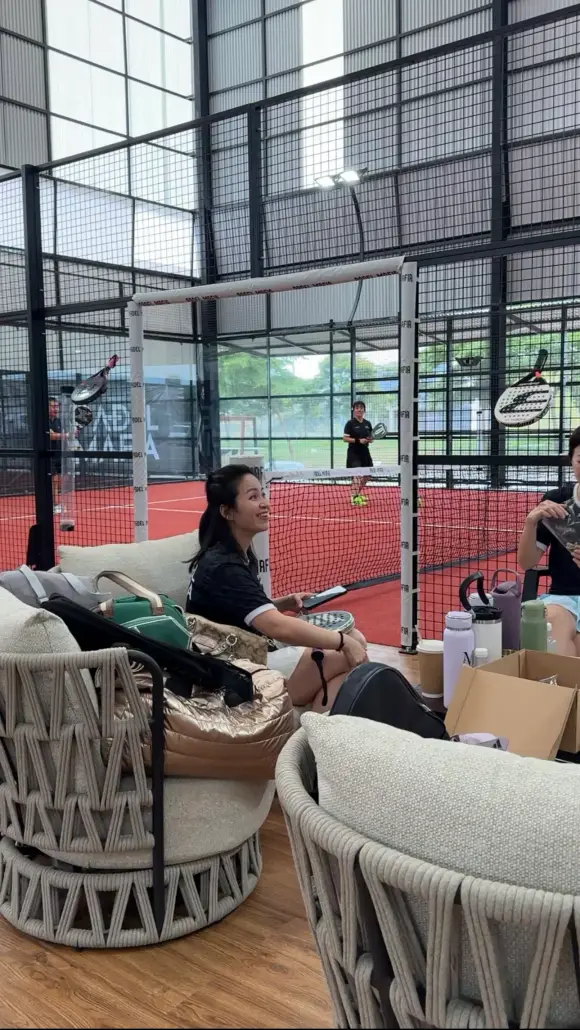 Players relaxing on sofas